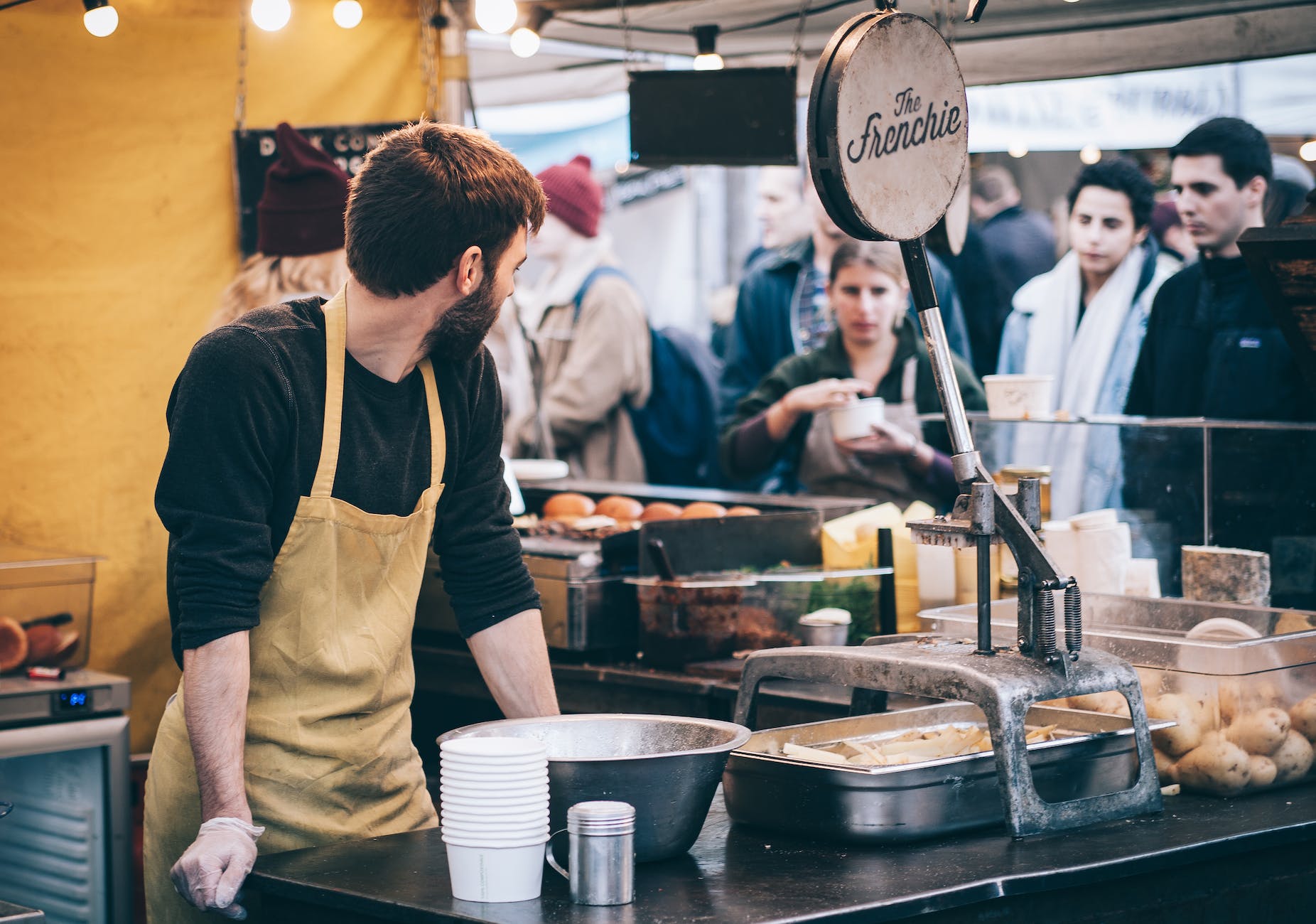 Sales vs. Marketing - man standing in front of bowl and looking towards left